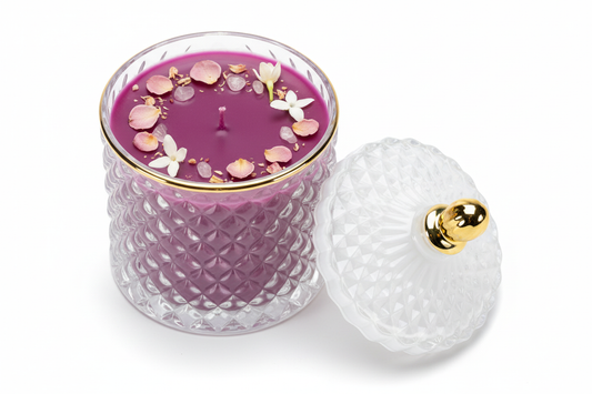 Purple aromatherapy candle with rose petals, jasmine, and crystals